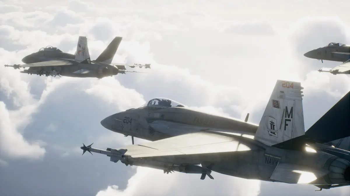 A fighter jet slices through bright clouds above a rugged coastline in Ace Combat 8: Wings of Theve.