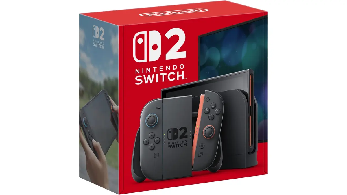 The front of the Nintendo Switch 2 retail box, showing the docked console with grey Joy-Con 2 controllers against the packaging's red background