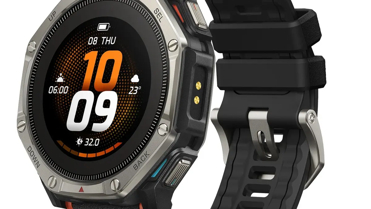 The Amazfit T-Rex Dual Solar, its titanium bezel, orange accents and black strap shown against a white background with an orange watch face on screen