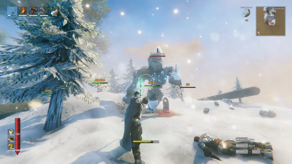 A heavily armoured Viking raises a glowing weapon towards a stone golem in Valheim’s snowy Deep North, with a fallen creature lying in the snow beside them.