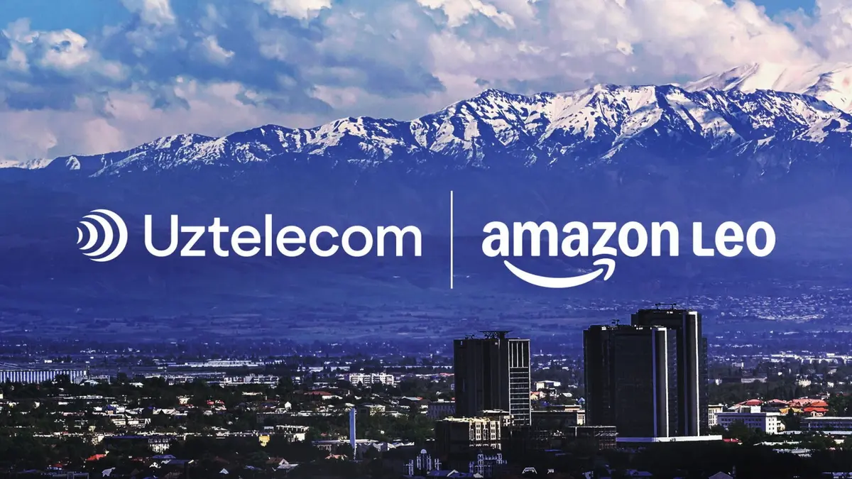 The co-branded announcement banner Amazon published with the deal, showing the Uztelecom and amazon leo logos over a photograph of a city with snow-capped mountains behind it.
