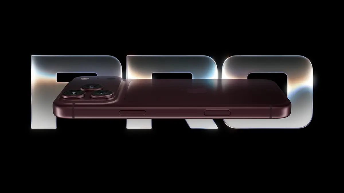 An iPhone 18 Pro photographed edge-on in a deep purple finish against the metallic PRO wordmark on a black background.