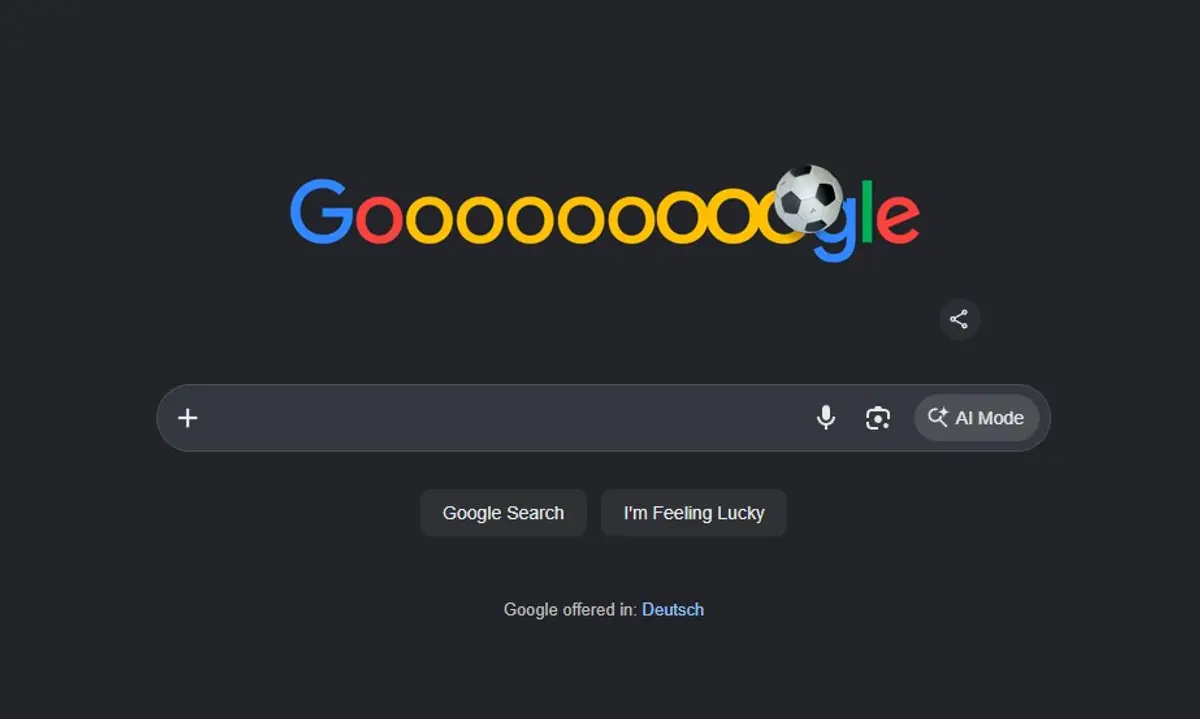 Supplied screenshot of the Google homepage in dark mode, showing the search bar with an AI Mode button and German language option, used illustratively for the European search changes story.