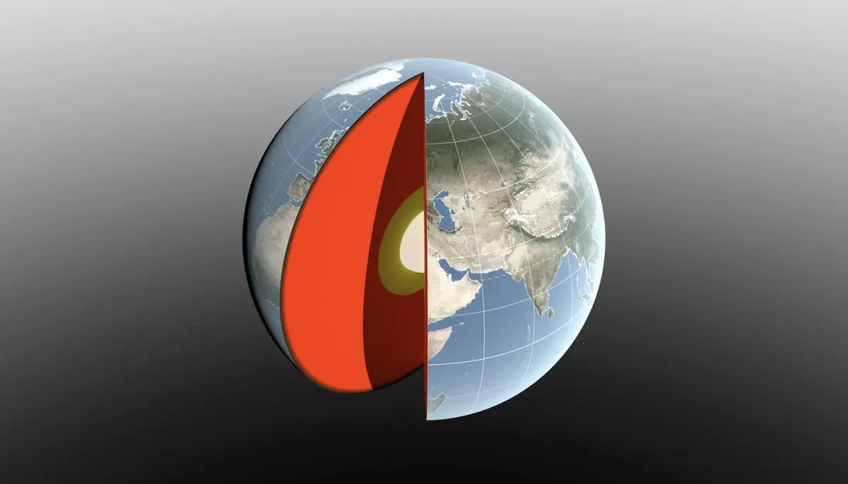 An illustration of Earth with a wedge cut away to reveal its red-hot interior layers, set against a dark background.