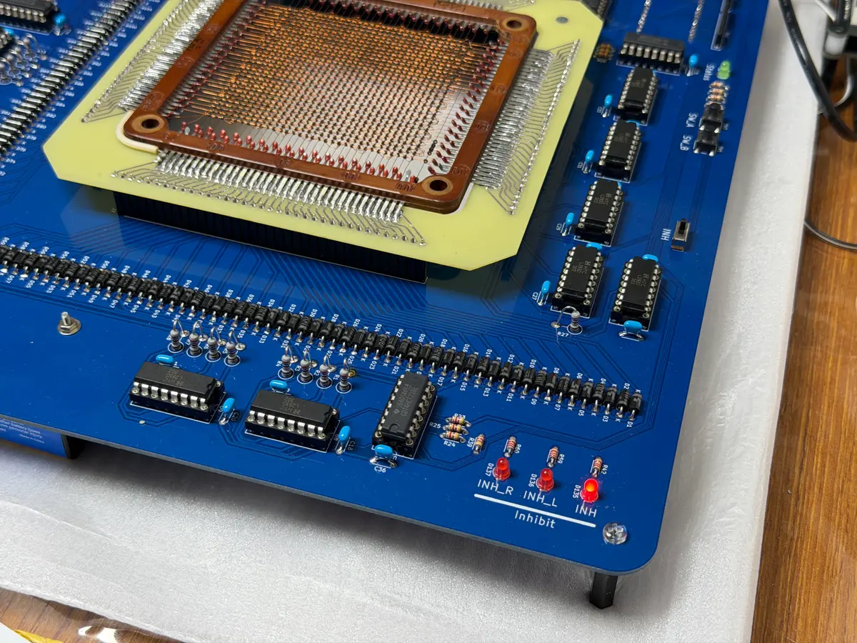 Photograph by @dydt_Nao showing the 128-byte magnetic-core memory board with its copper core matrix and driver circuitry