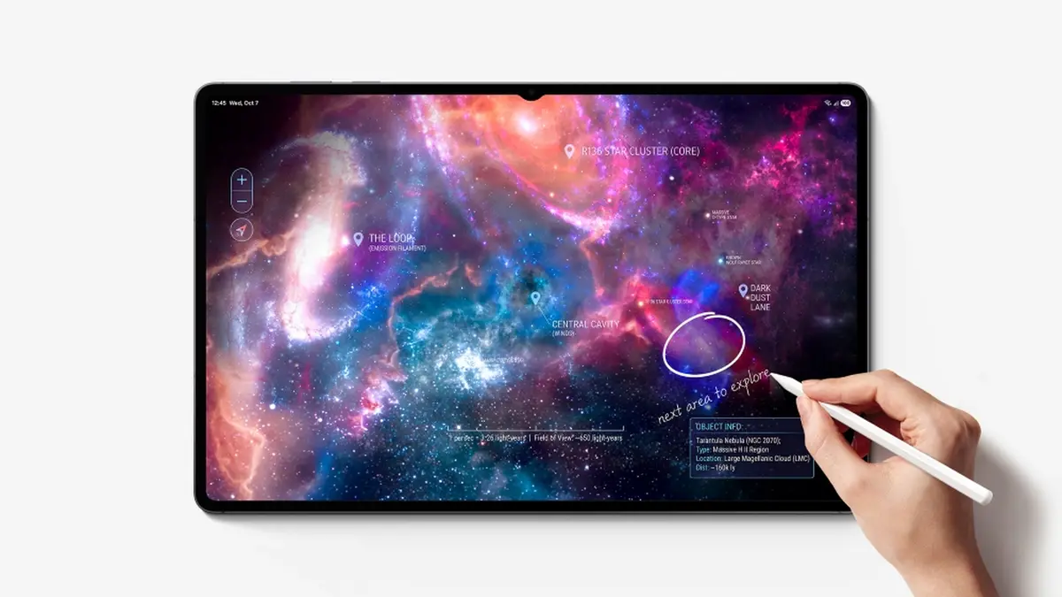 A hand holding the S Pen against a Galaxy Tab S12 Ultra displaying a purple and blue star map app with an annotation circled in pen
