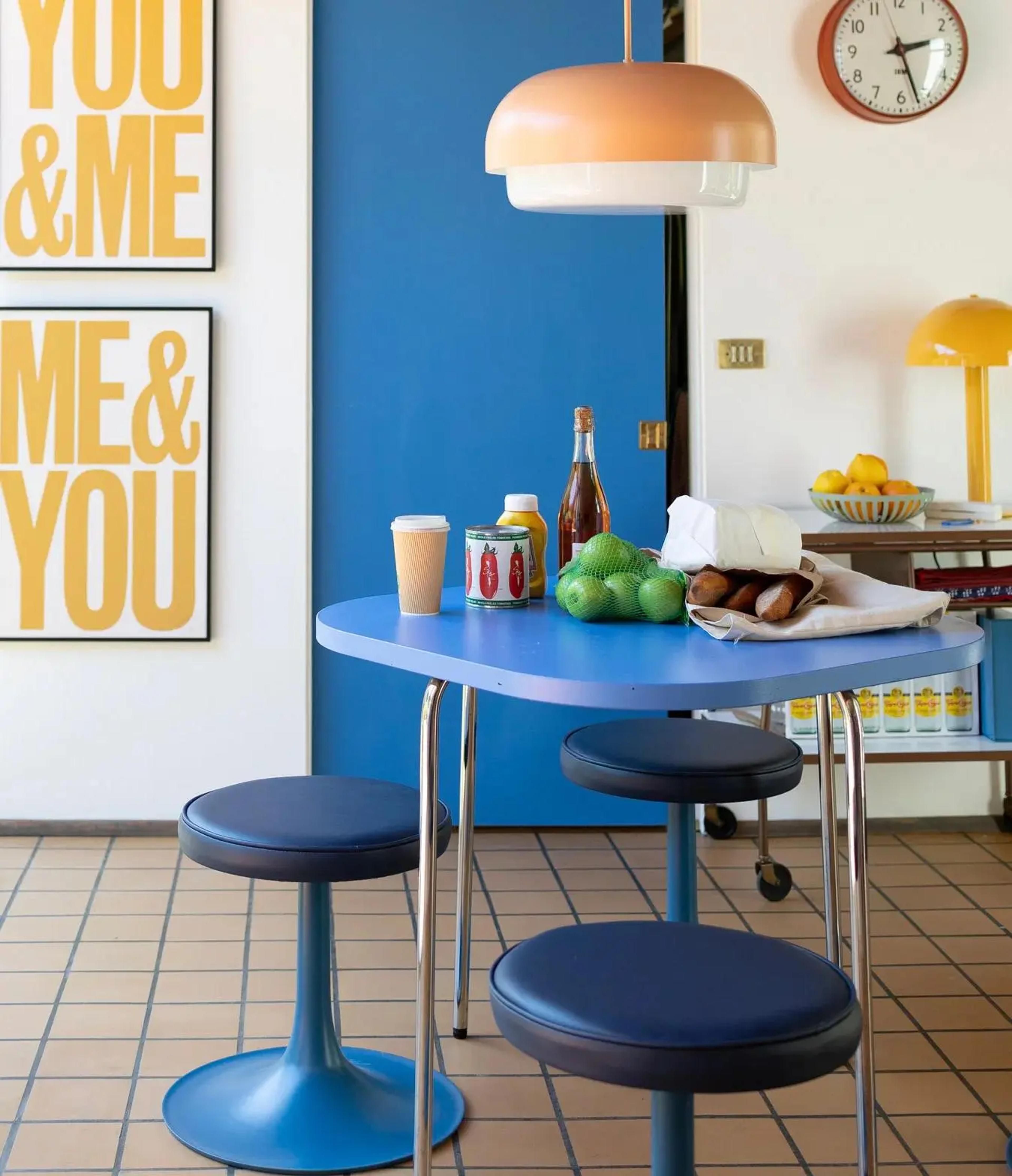 A kitchen with a blue table
