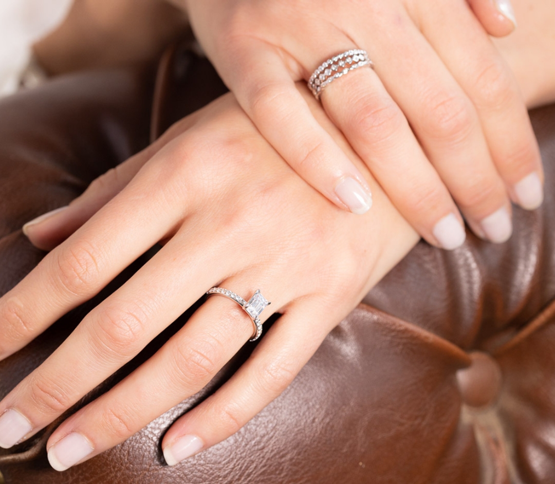 A photo of a woman‘s hands wearing silver rings