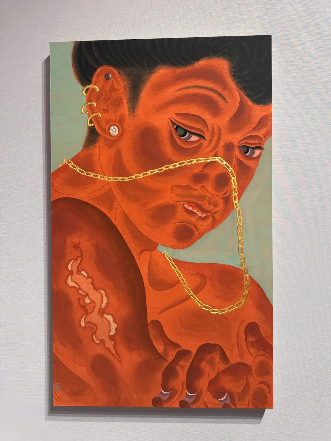 Tseng Chien-Ying’s Afterglow (2026), an orange-red figure wearing gold jewellery, shown at Asia NOW.