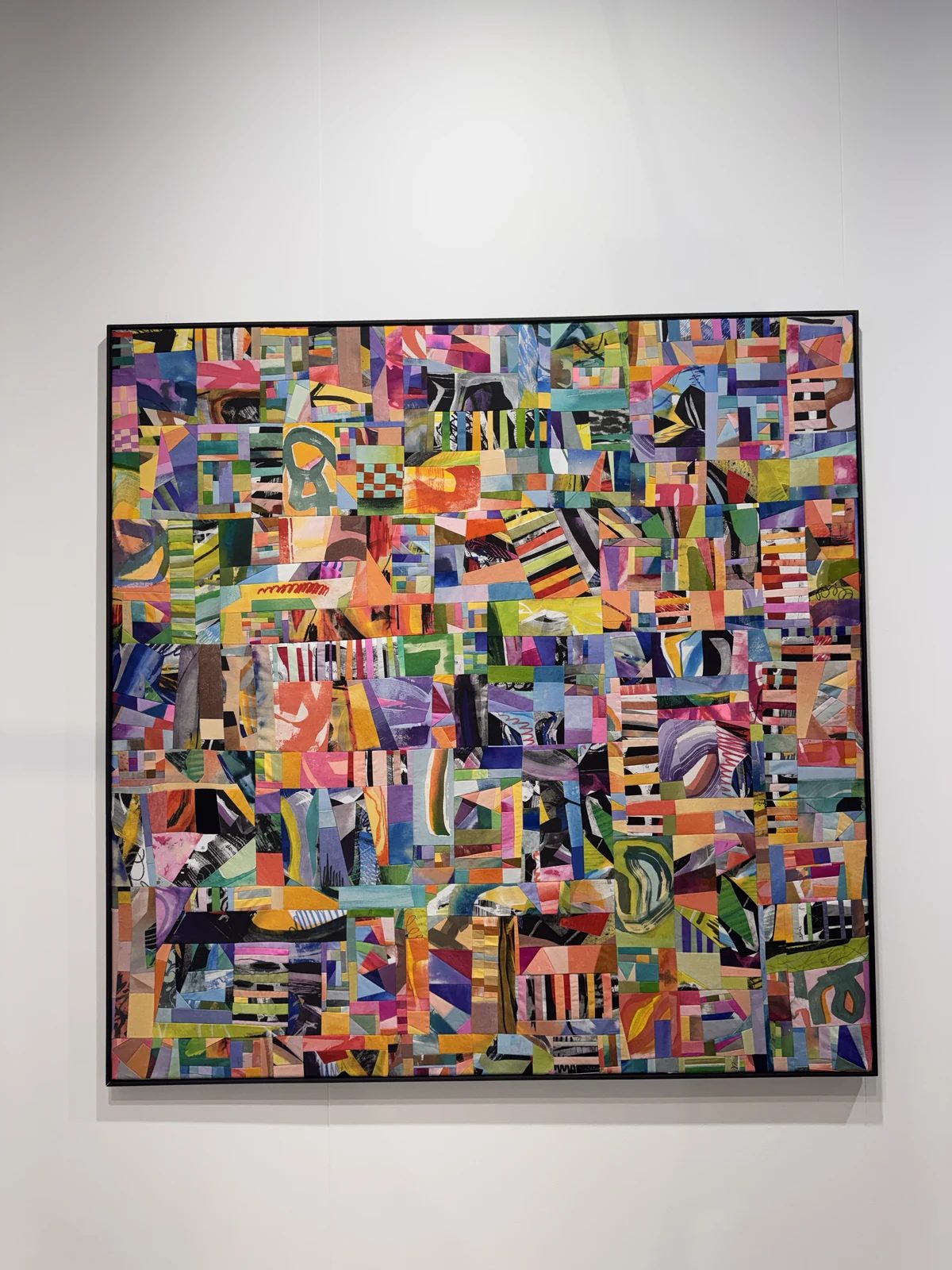 A framed patchwork by Kaja Gadomska composed of colourful textile fragments at Leto Gallery’s Riga Contemporary booth.