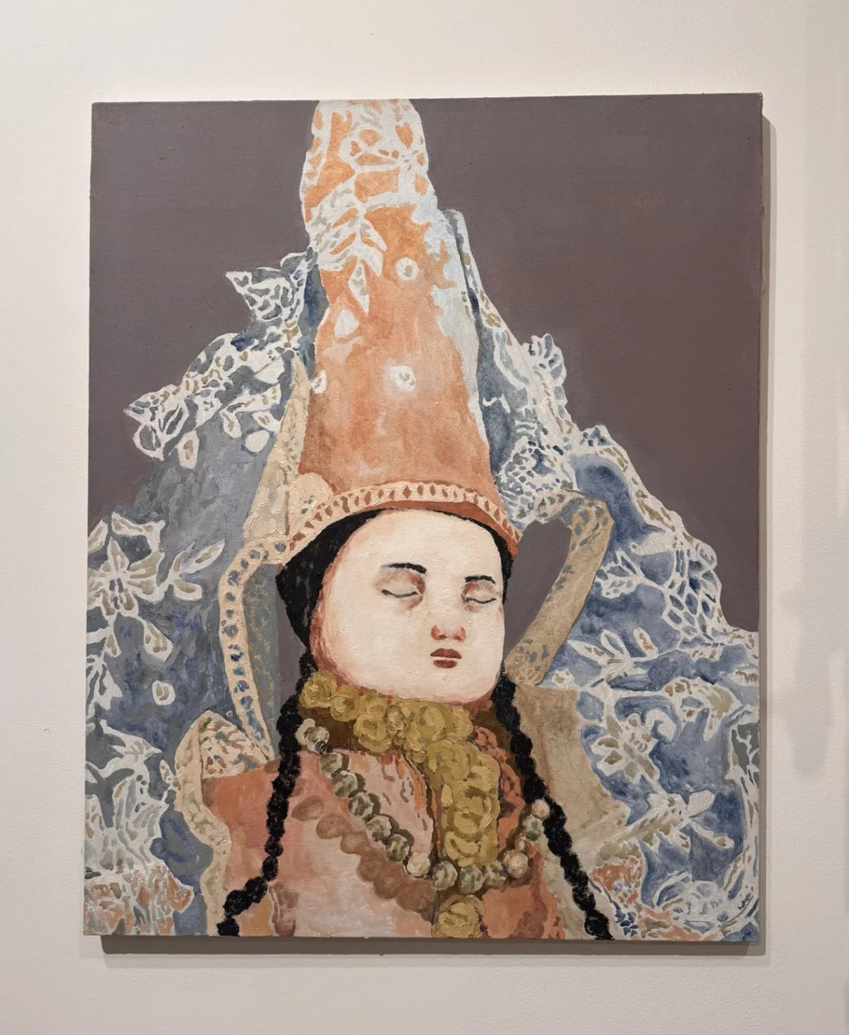 A portrait by Maya Hewitt showing a figure with braided hair and a tall headdress, at Post-Fair Paris 2026.