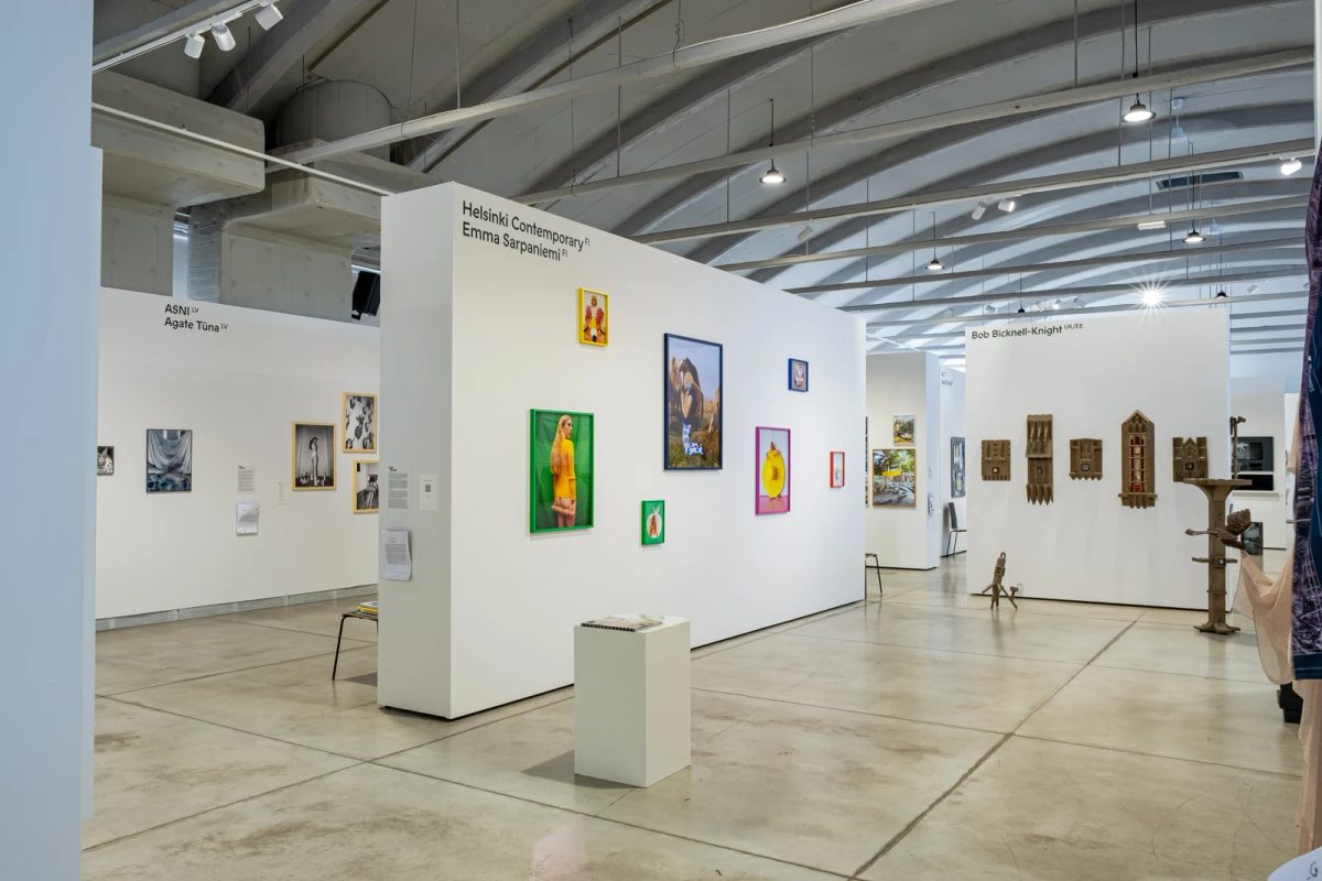 Colourfully framed photographs by Emma Sarpaniemi on Helsinki Contemporary’s booth walls at FOTO Tallinn.