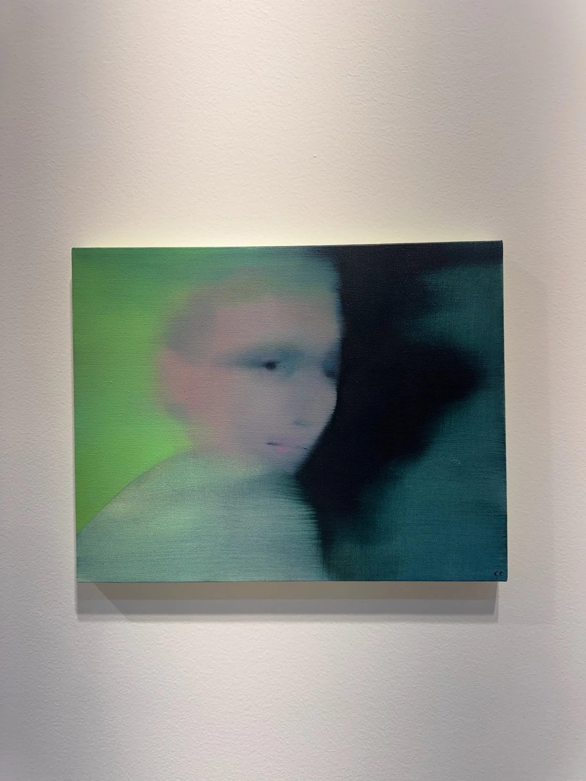 Cathleen Clarke’s Interlude, 2026, a dreamlike portrait in muted green and blue tones at Margot Samel Gallery’s Riga Contemporary booth.