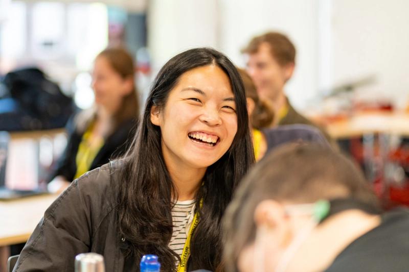 A Musicians of Change participant laughing with fellow music educators during a training session.
