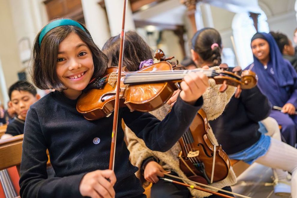 School children learning instruments