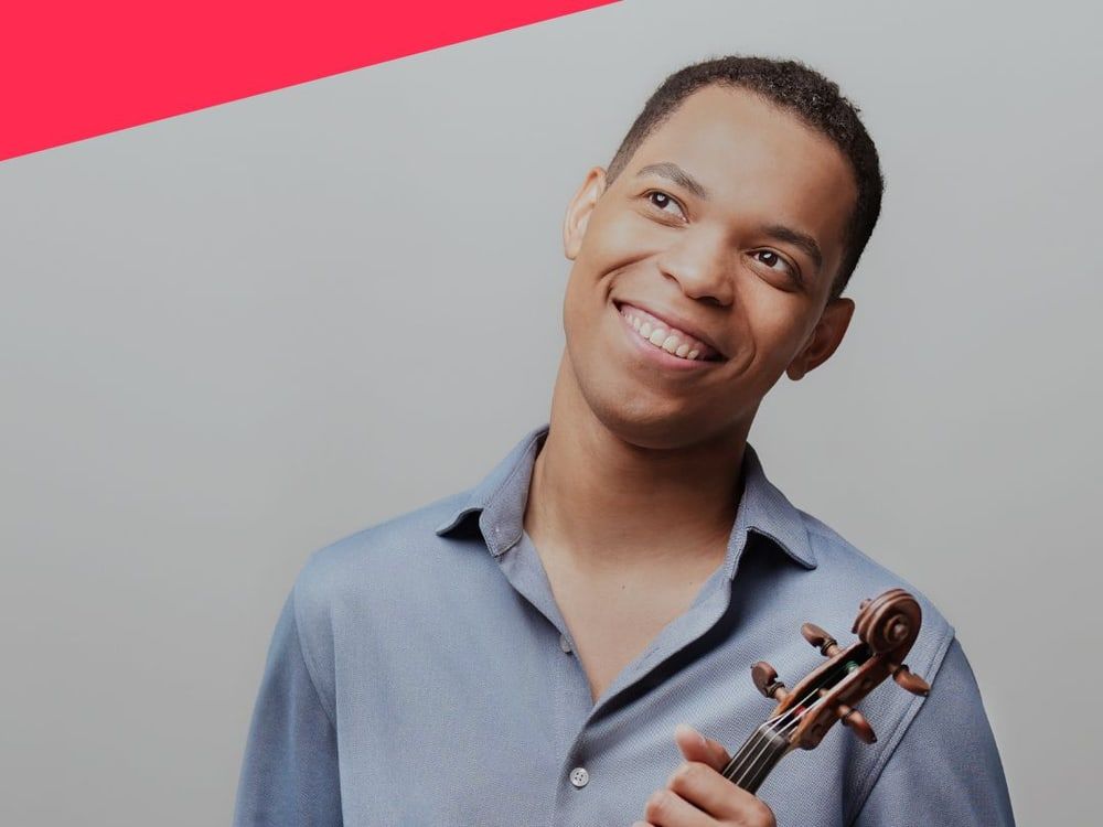Nathan Amaral holding his violin