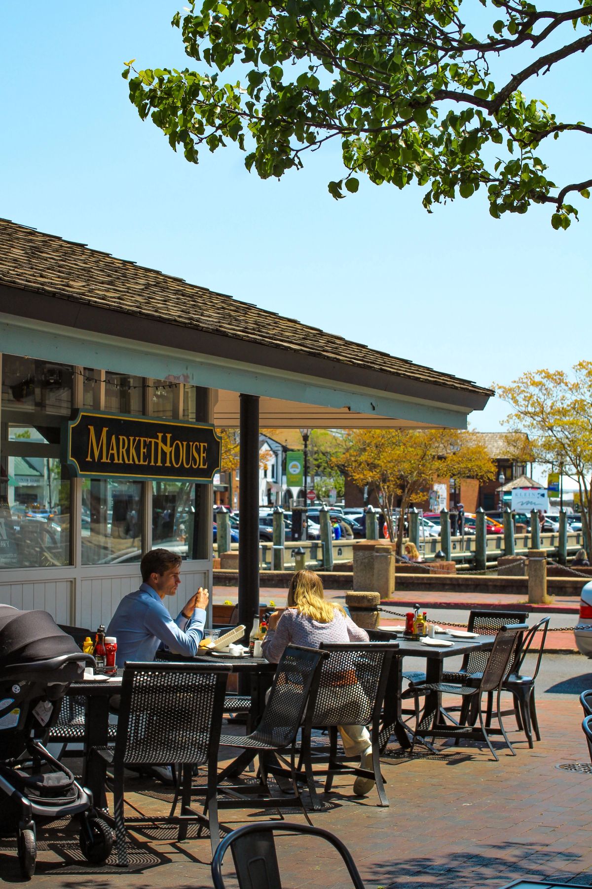 People dining outdoors at Market House in downtown Annapolis