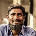 Omar Haddad, reviewer — professional headshot of a smiling bearded man.