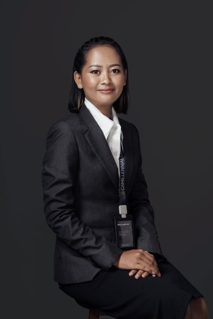 Grace Liu, reviewer — professional headshot of a smiling Asian woman in formal business attire.