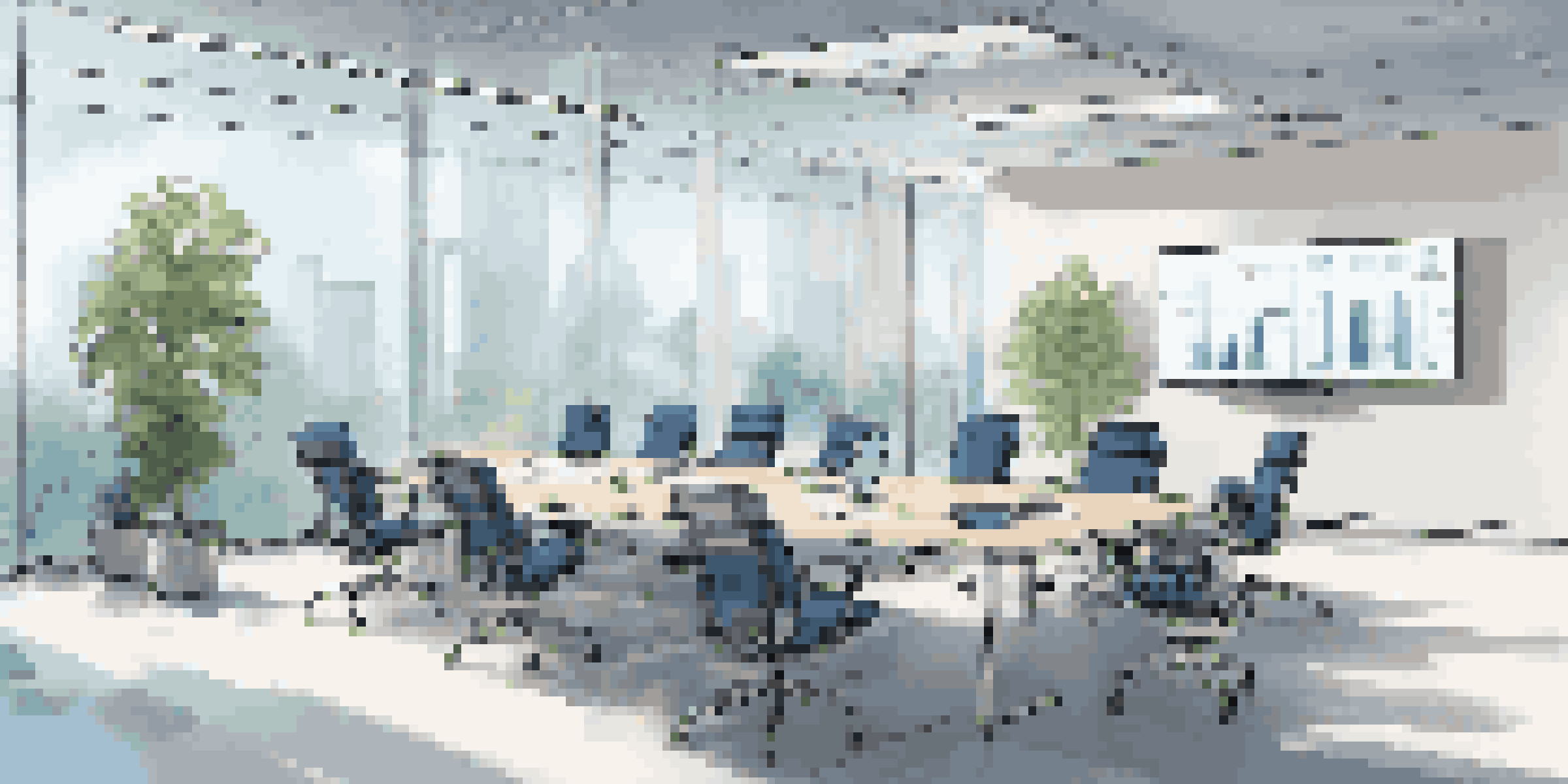 A modern conference room with a large table, ergonomic chairs, plants, and a digital screen showing retargeting strategies.