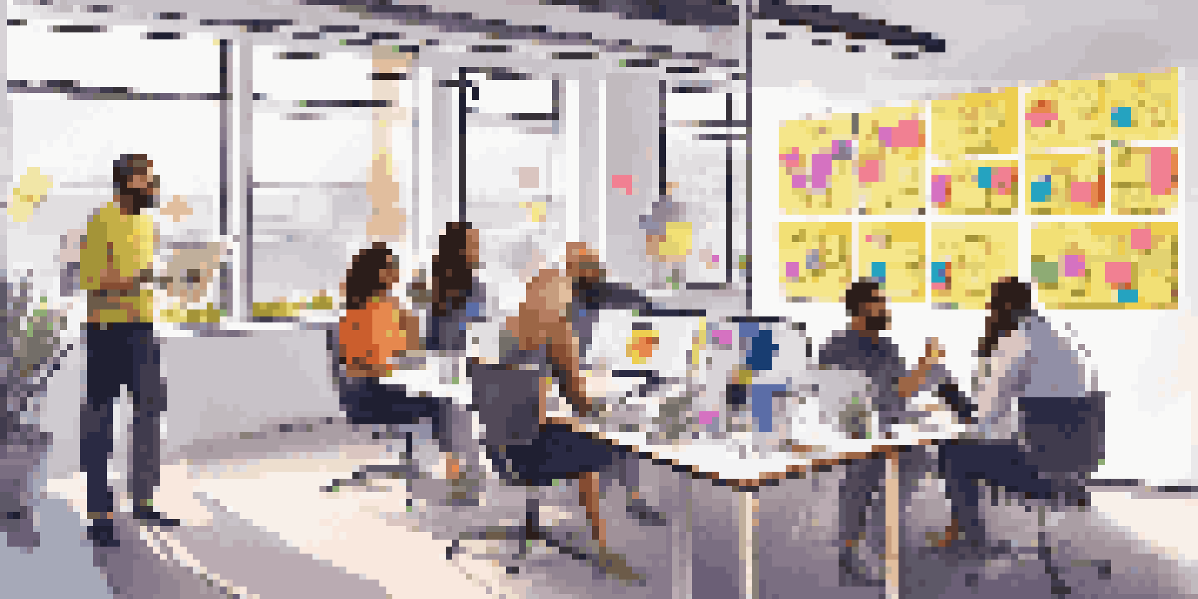 A group of diverse professionals in a modern office collaborating on social media marketing strategies with colorful post-it notes and laptops.