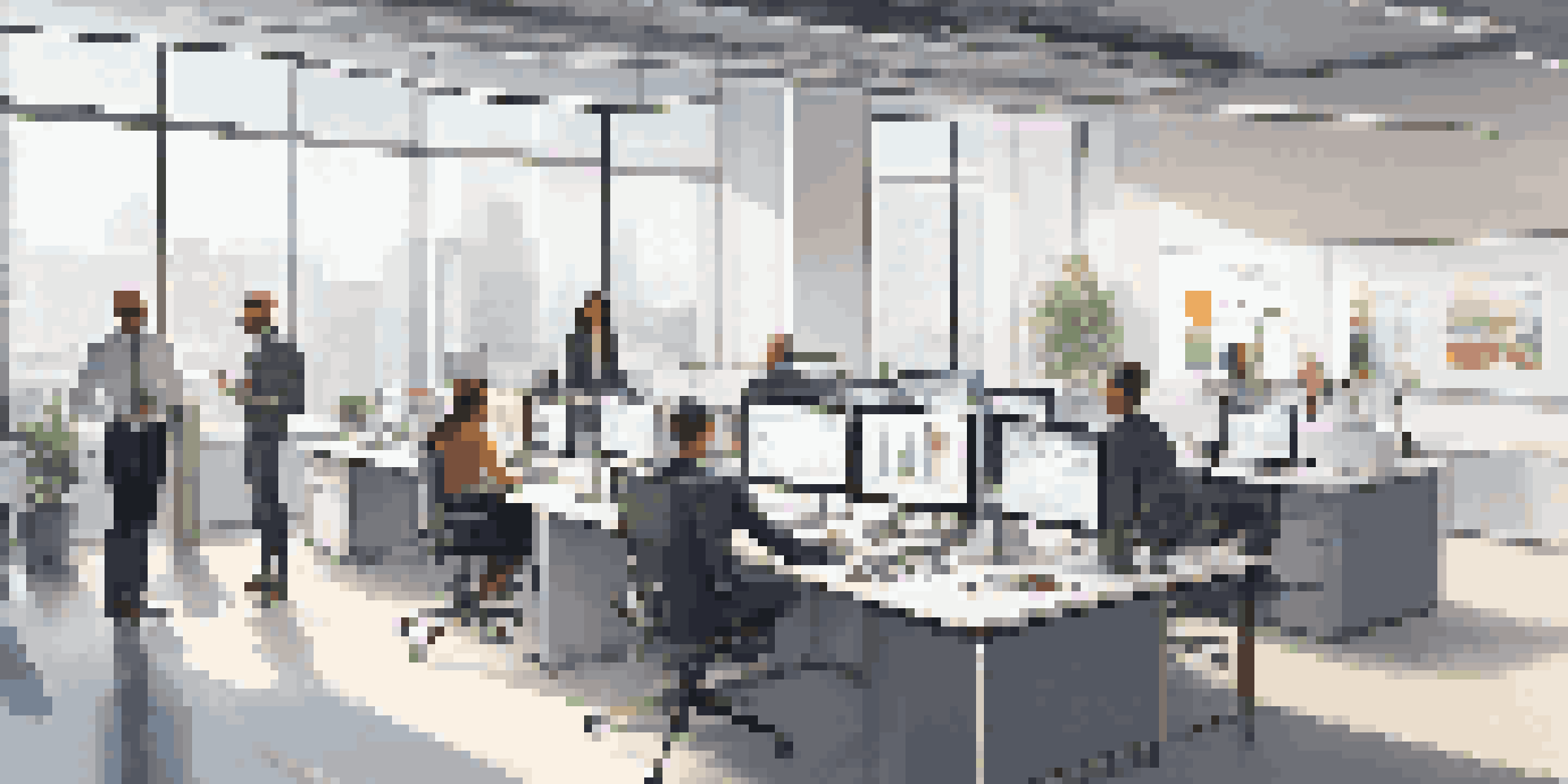 A modern office with a diverse team of professionals collaborating over data analytics on digital screens and charts.