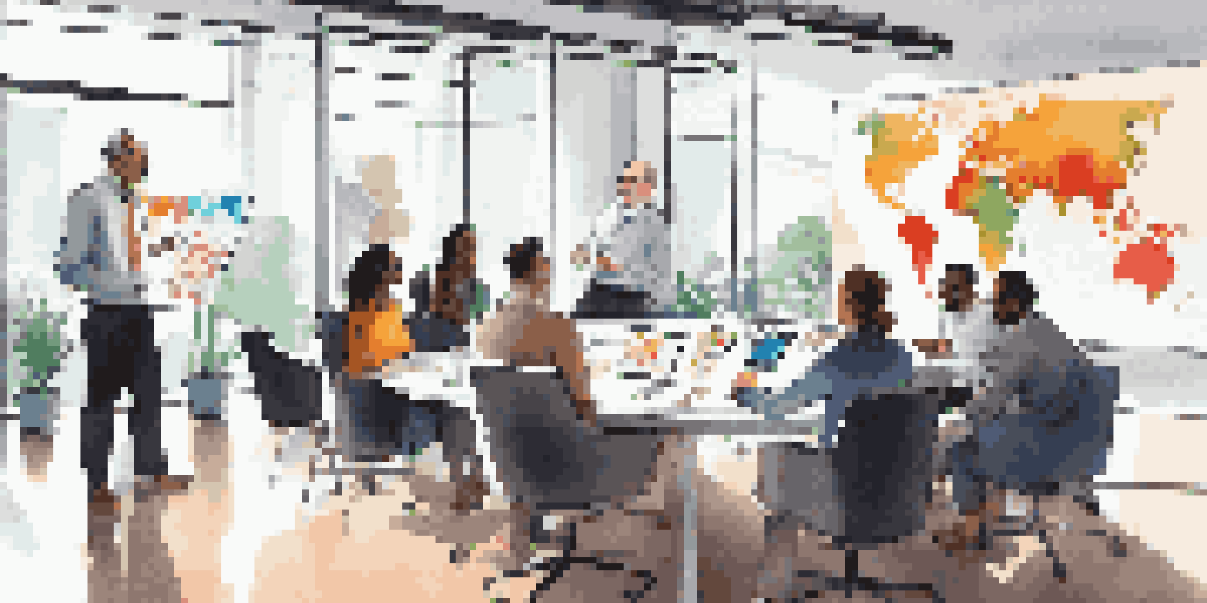 A diverse group of entrepreneurs discussing financial projections in a modern office conference room.