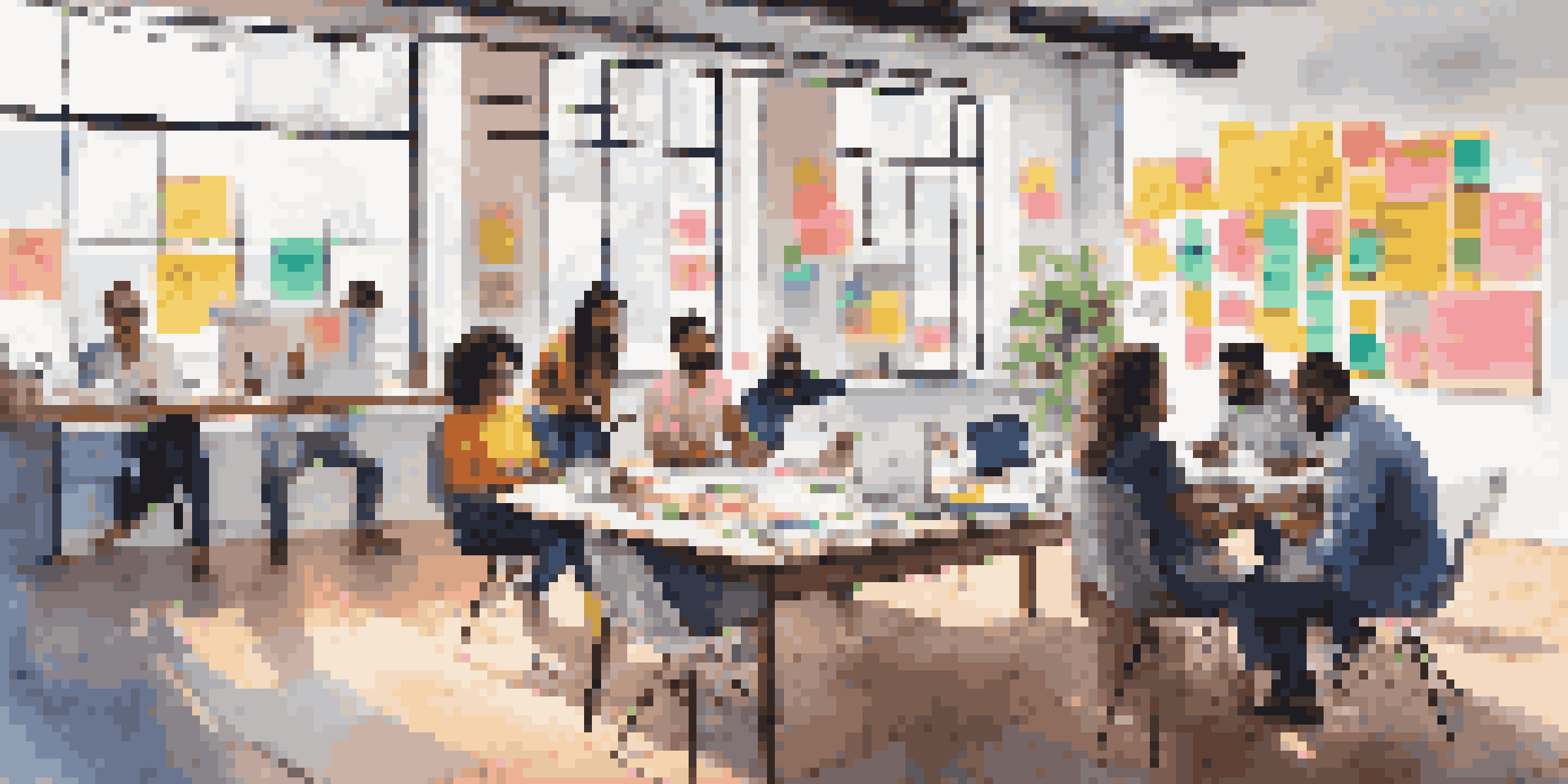 A diverse group of entrepreneurs working together around a large Business Model Canvas filled with colorful sticky notes and brainstorming materials in a bright workspace.