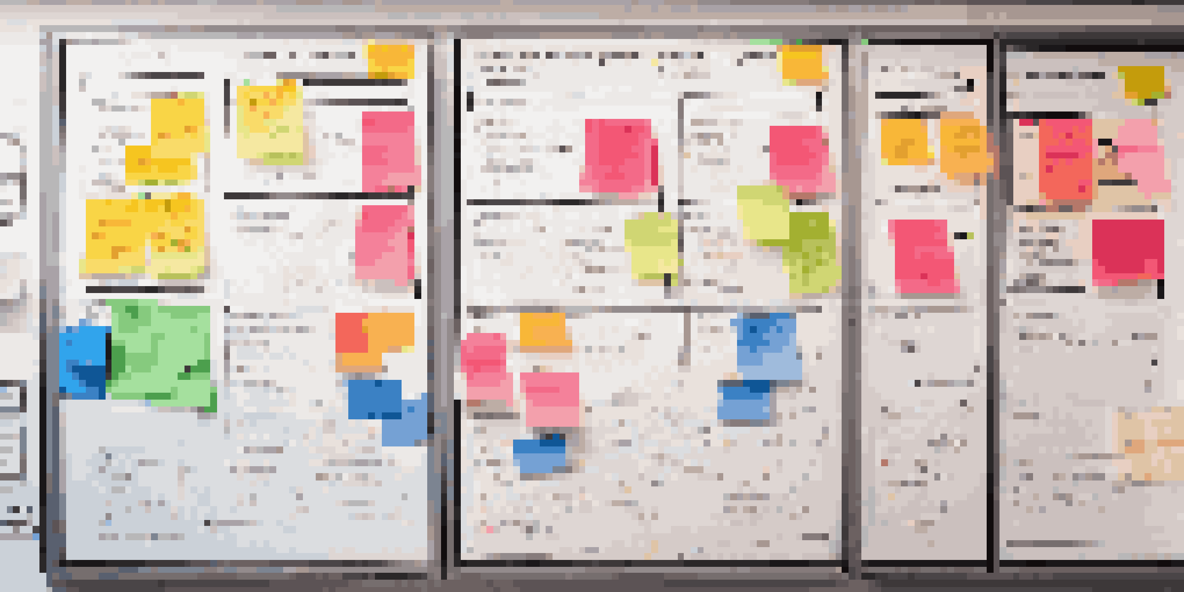 A detailed project management whiteboard with colorful sticky notes and charts in a bright office setting.