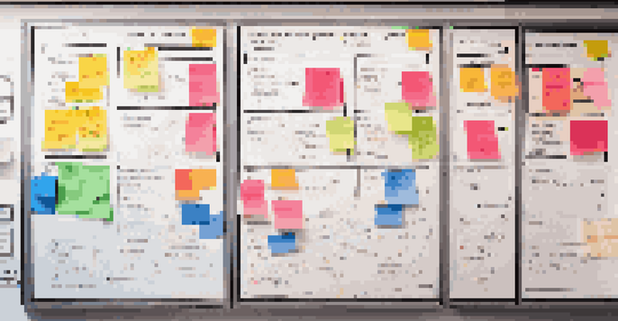 A detailed project management whiteboard with colorful sticky notes and charts in a bright office setting.