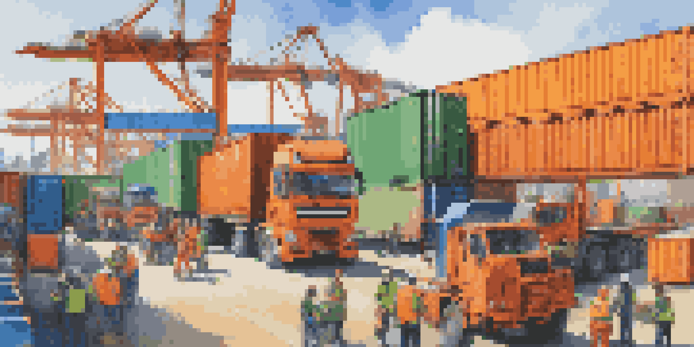 A busy logistics hub with workers coordinating shipments and cargo containers being loaded onto trucks under a blue sky.