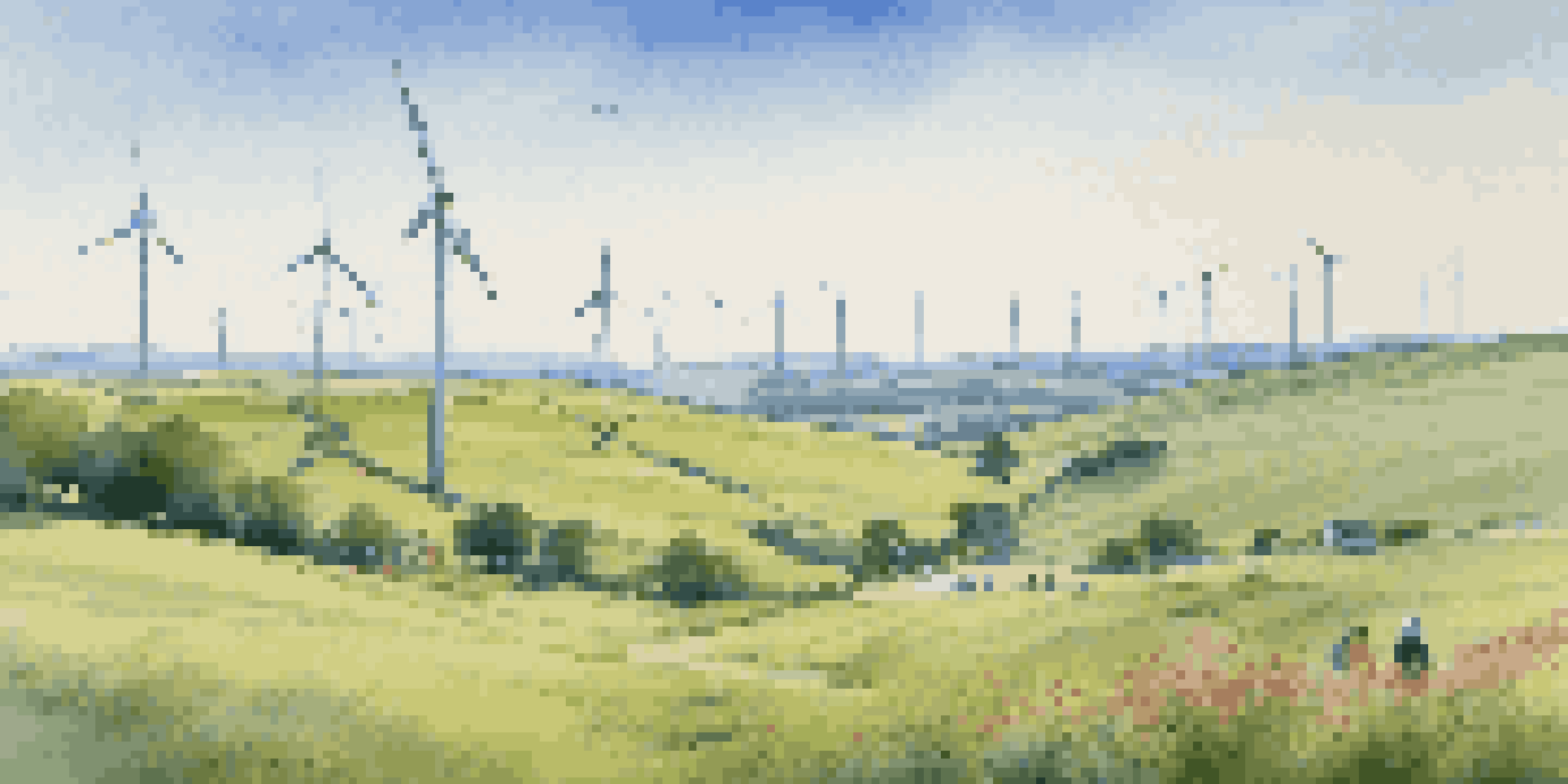 A peaceful landscape with wind turbines on green hills and people discussing renewable energy.