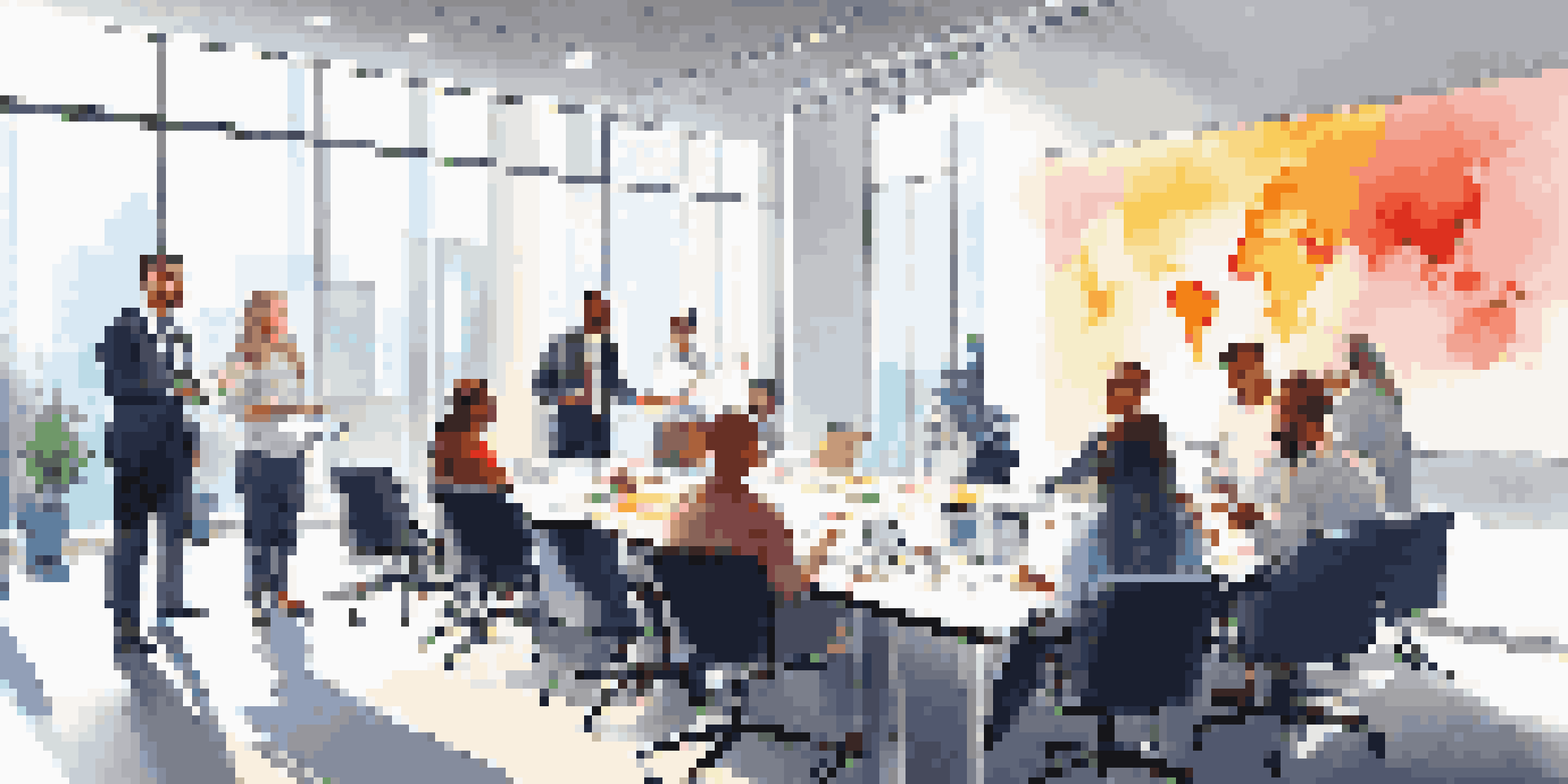 A diverse group of employees participating in a leadership training workshop in a well-lit conference room.