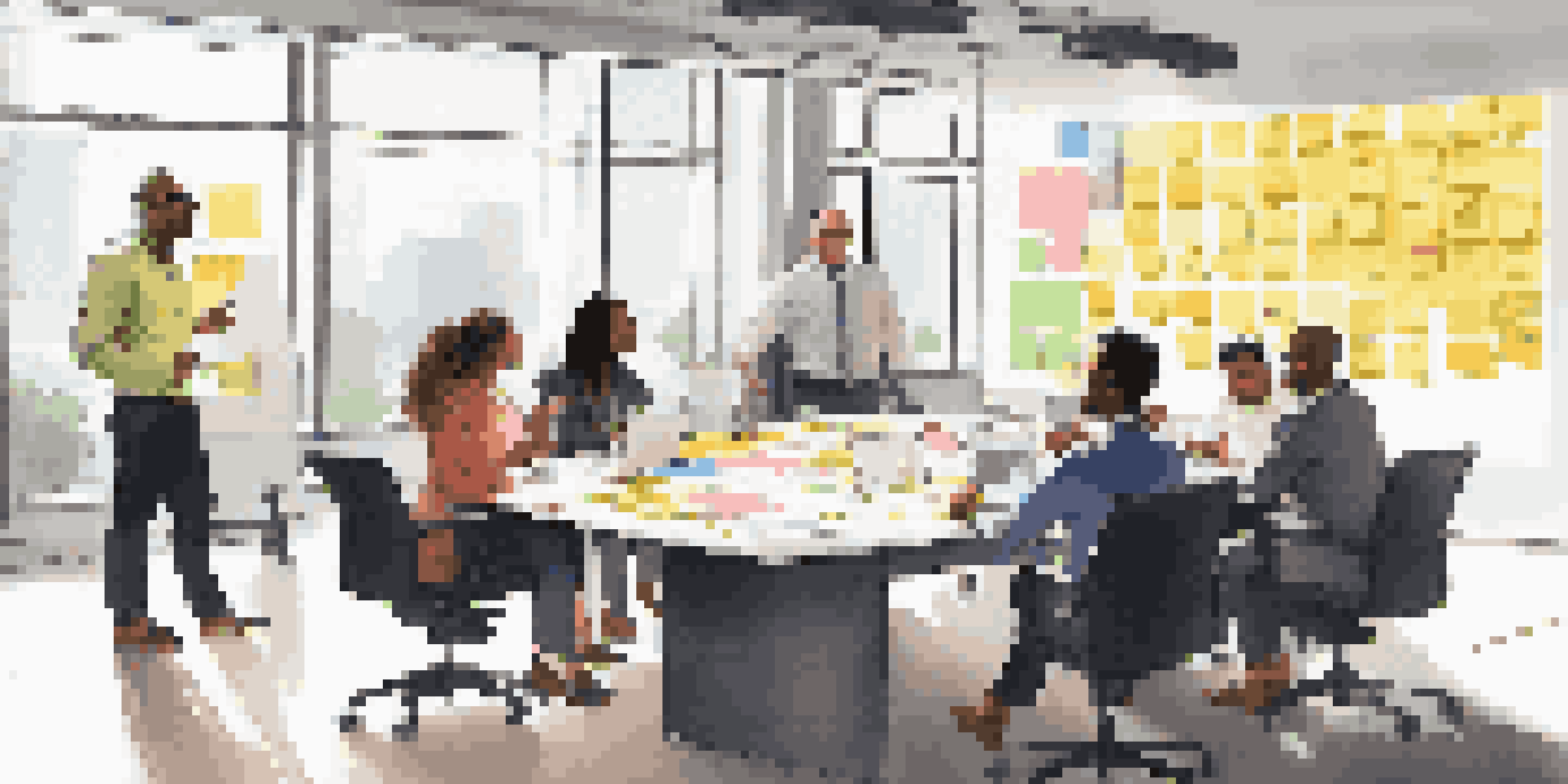 A diverse group of professionals engaging in a brainstorming session at a conference table, with colorful post-it notes and a digital whiteboard.