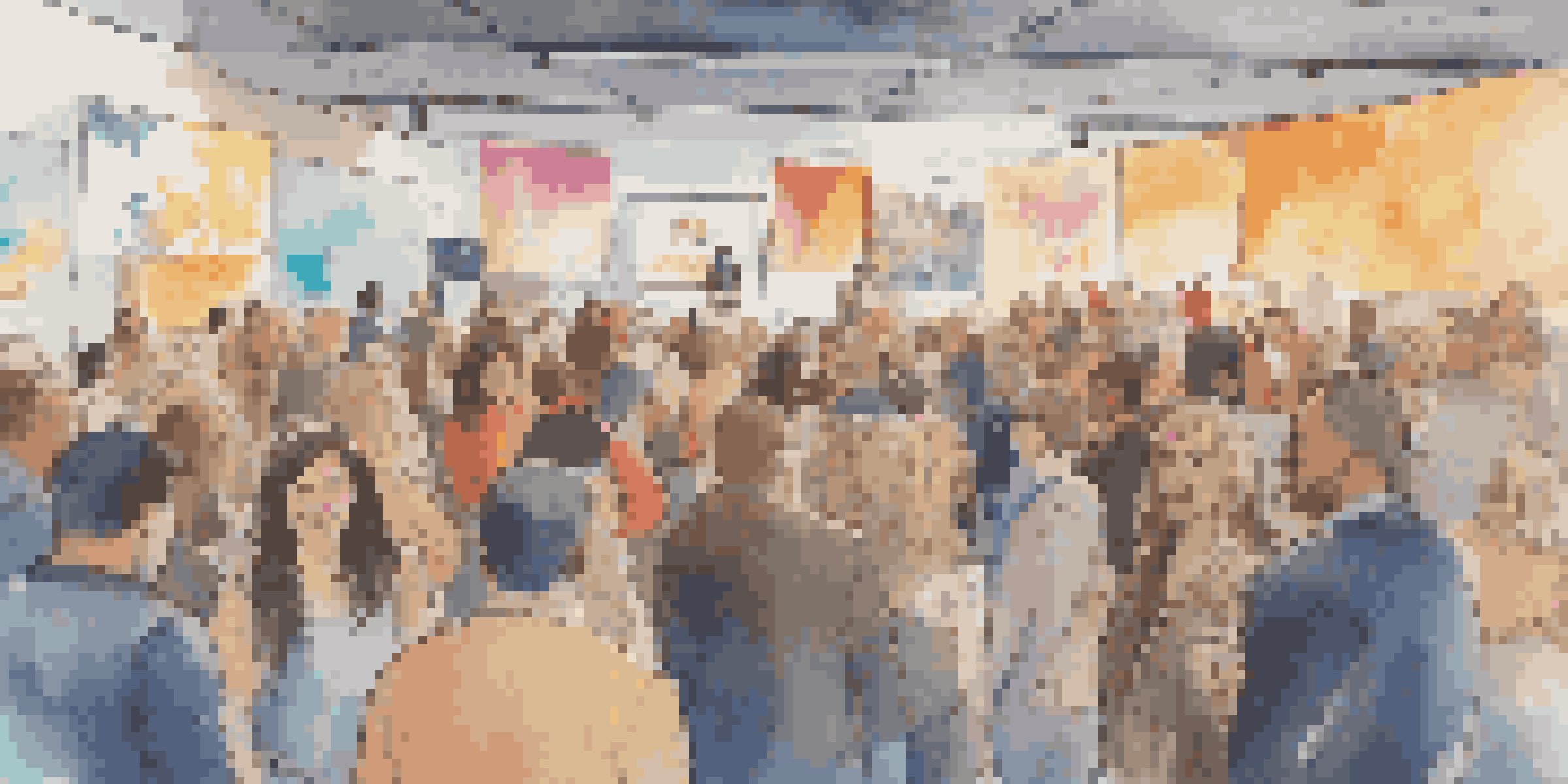 A vibrant crowdfunding event with diverse creators and backers engaging over various projects, illuminated by warm lighting.