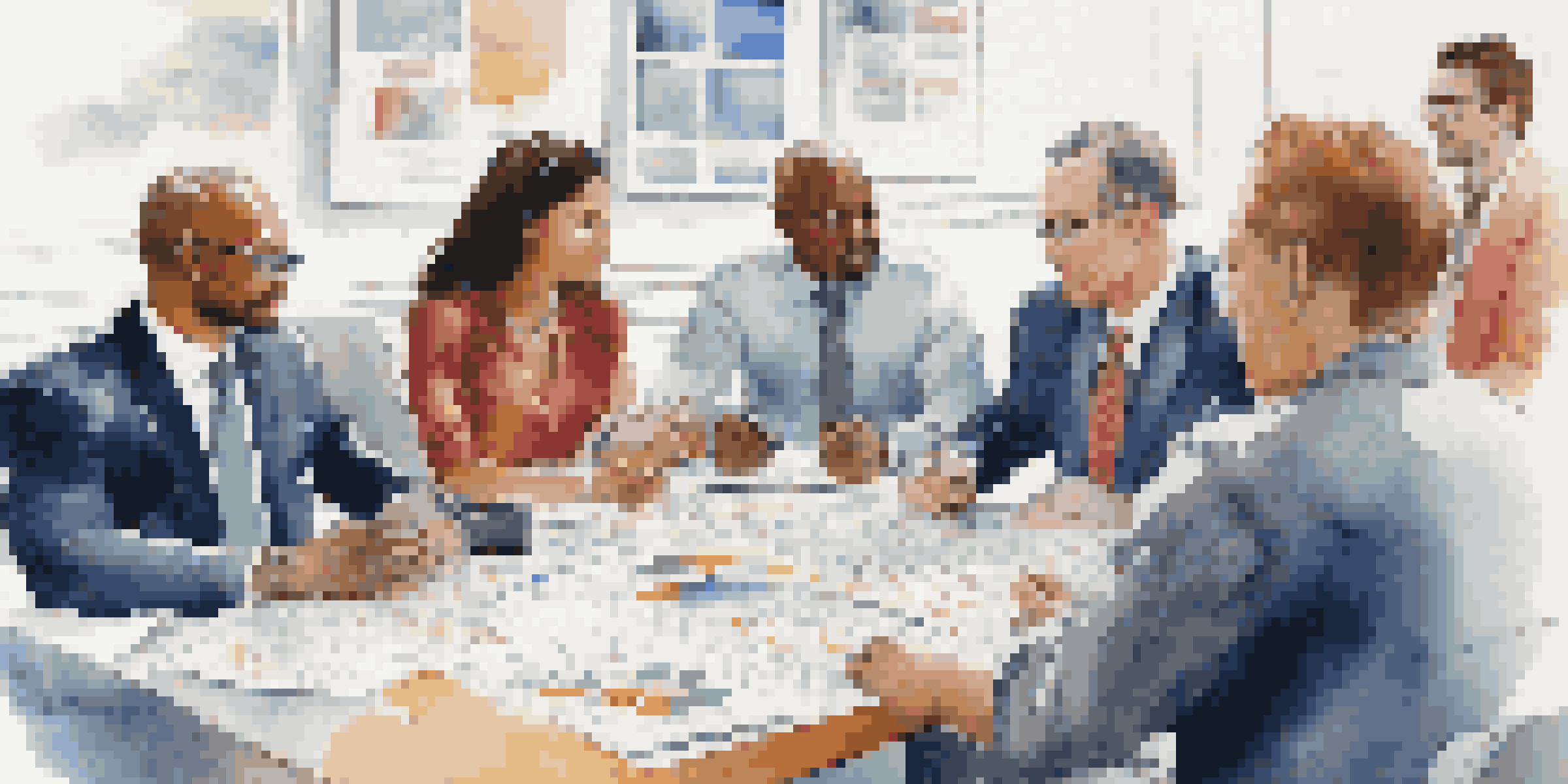 A diverse group of individuals discussing business law and consumer rights around a table in a modern office setting.