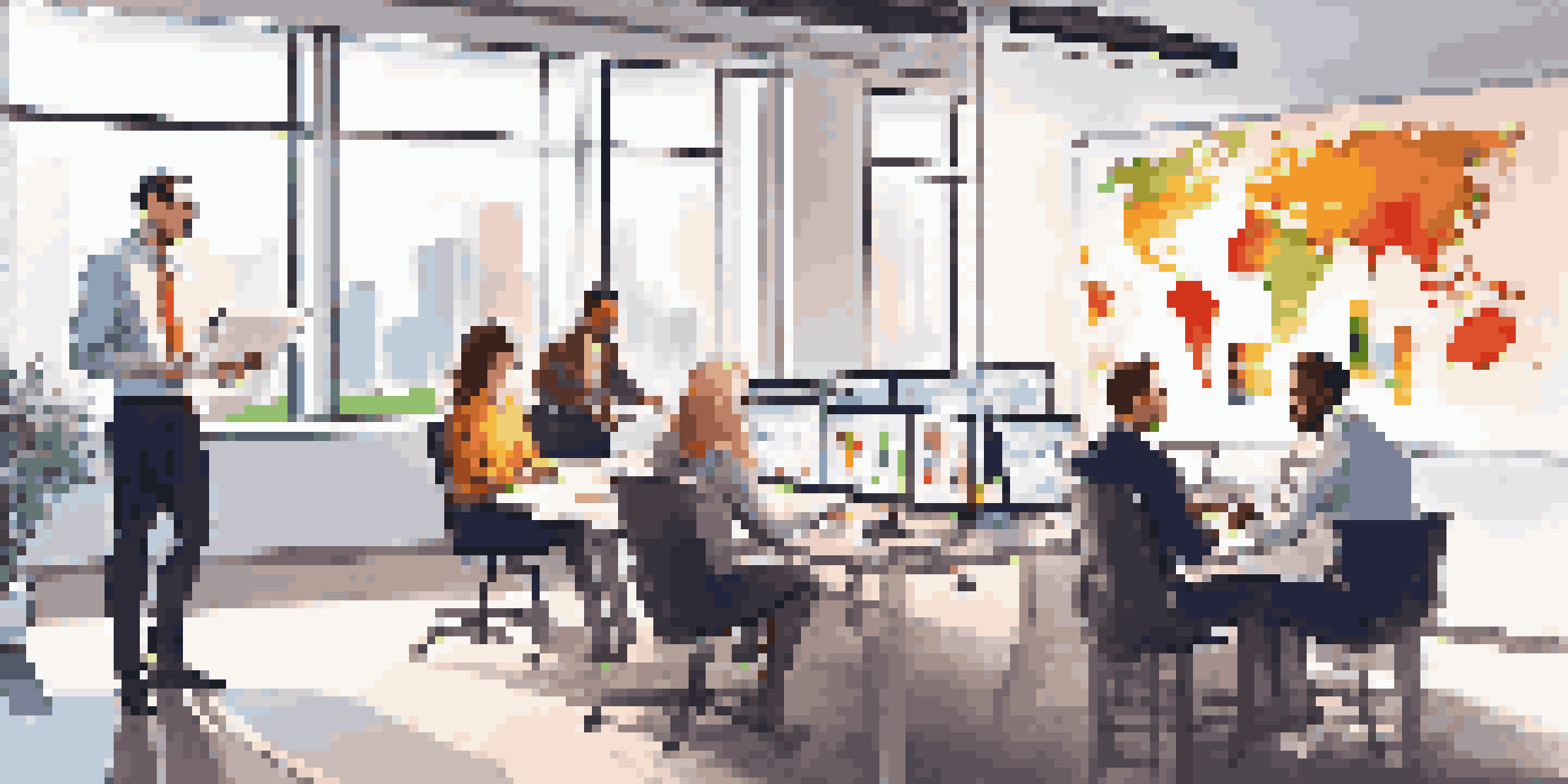 A diverse team of sales professionals working together in a bright office, discussing strategies with laptops and charts around them.