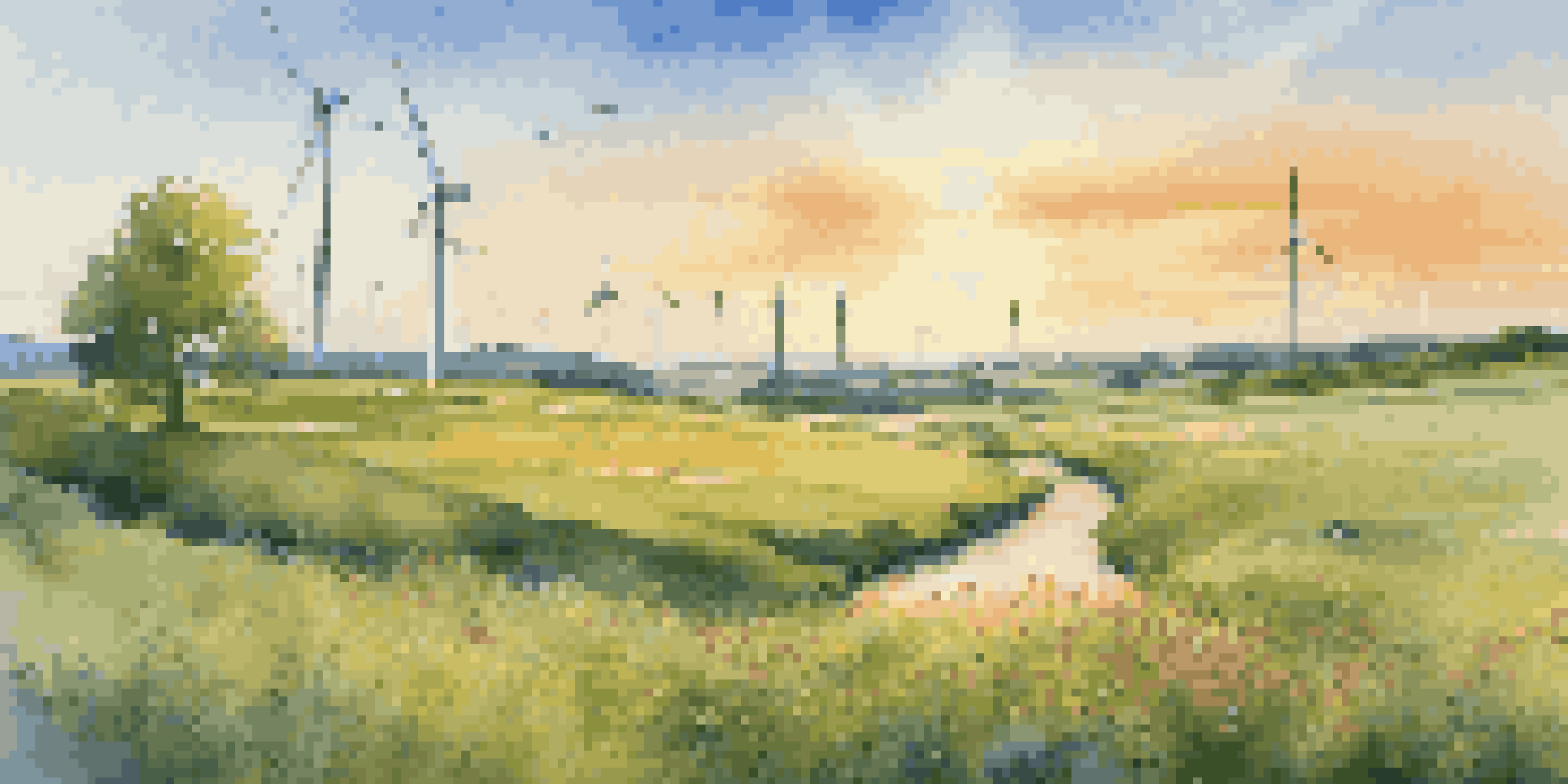 A picturesque landscape with solar panels and a wind turbine, showcasing renewable energy in a vibrant green field with wildflowers.