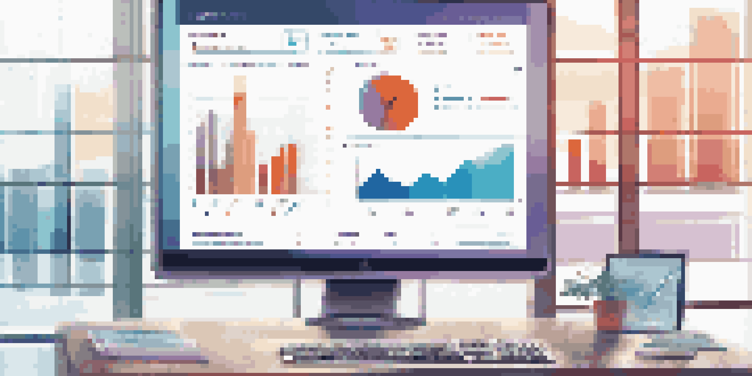 A modern KPI dashboard on a computer monitor, showcasing colorful graphs and charts in a bright office environment.