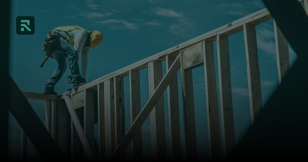 Builder framing a house
