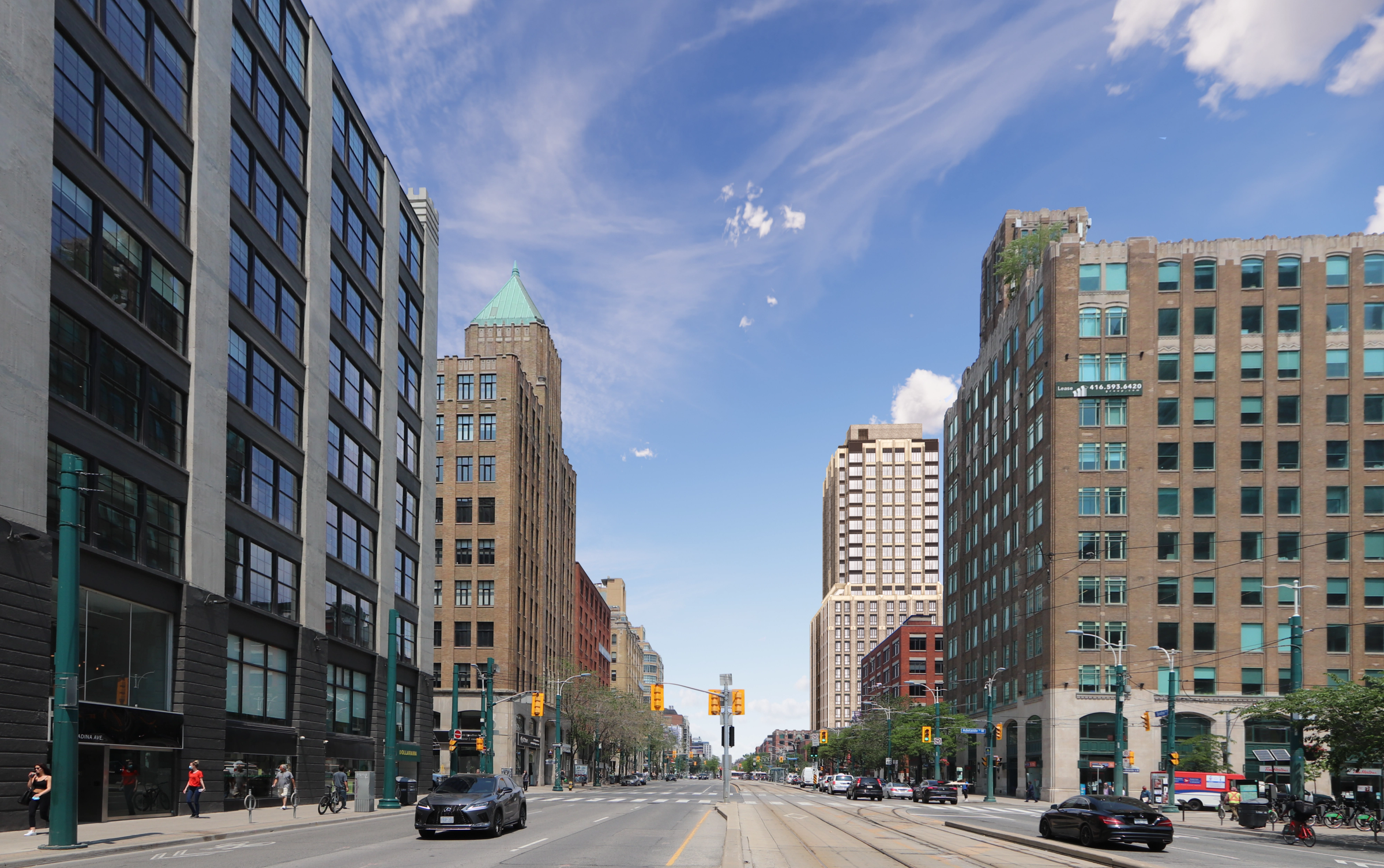 Wide downtown street lined with brick low-rises