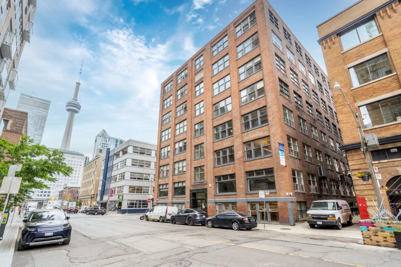 Brick loft building with the CN Tower behind