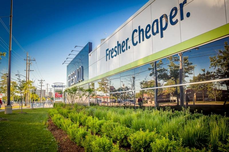 Retail facade behind planted landscaping