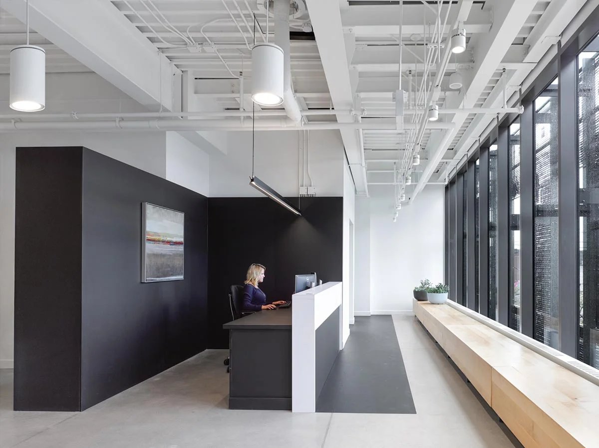 Office lobby desk with a person working