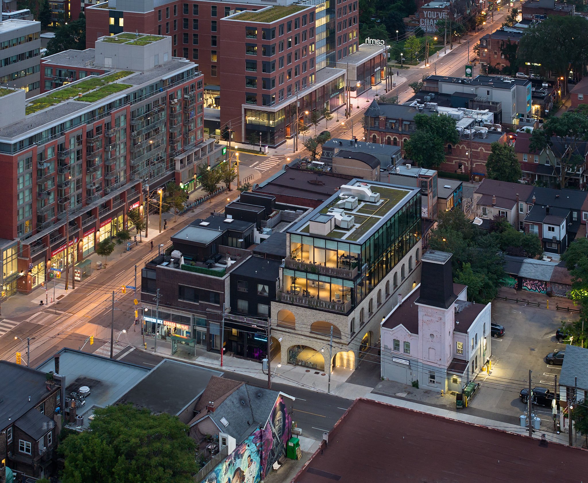 Aerial dusk view of low-rise retail buildings