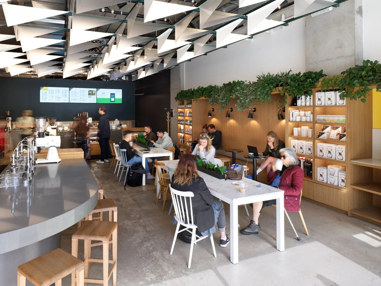 Cafe interior with white tables and folded ceiling