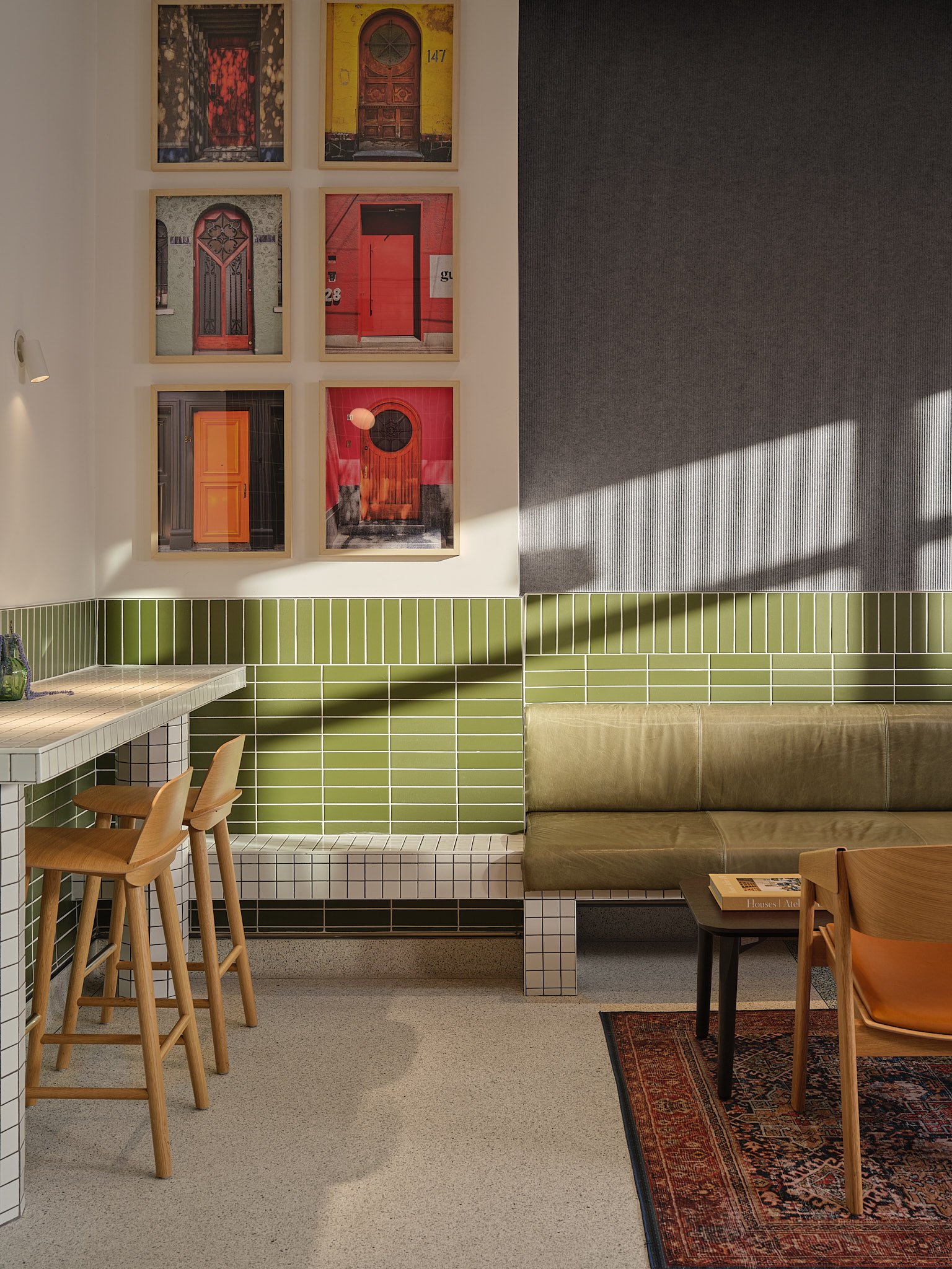 Cafe with green tile and framed door photos