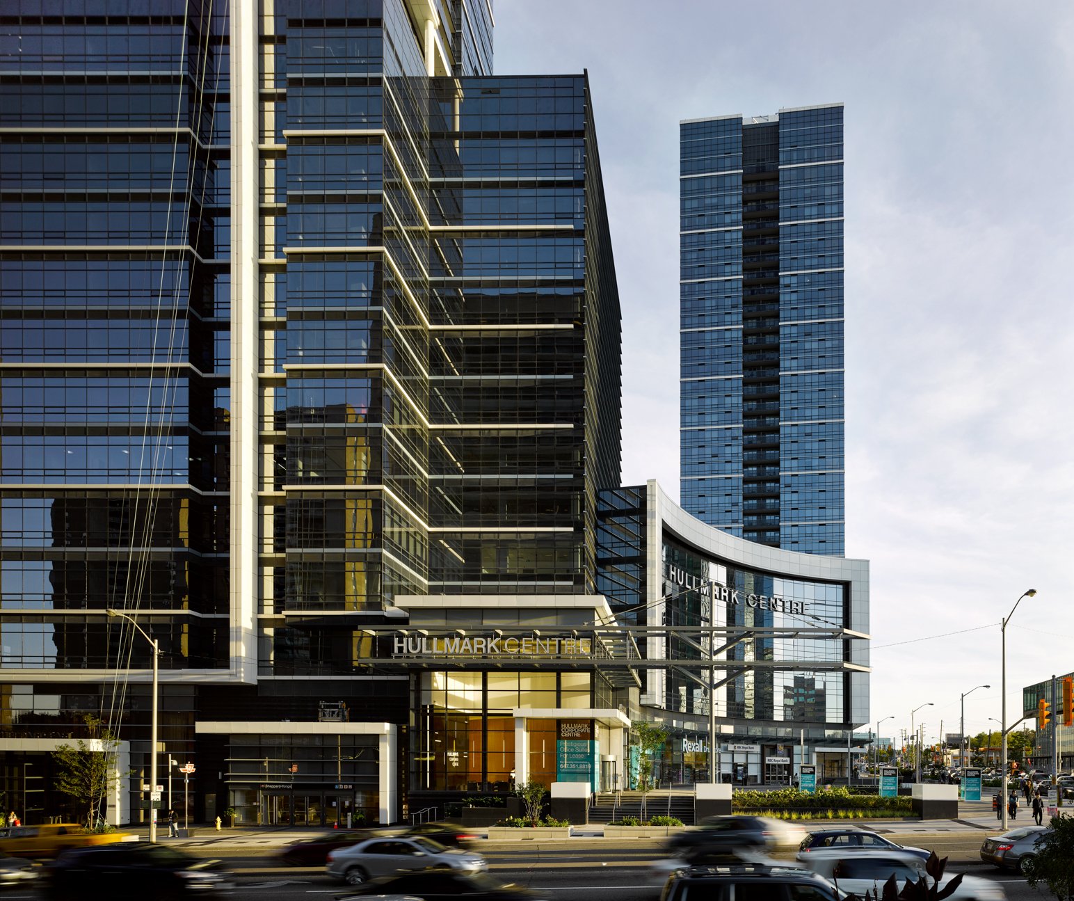 Glass office and retail podium below a tower