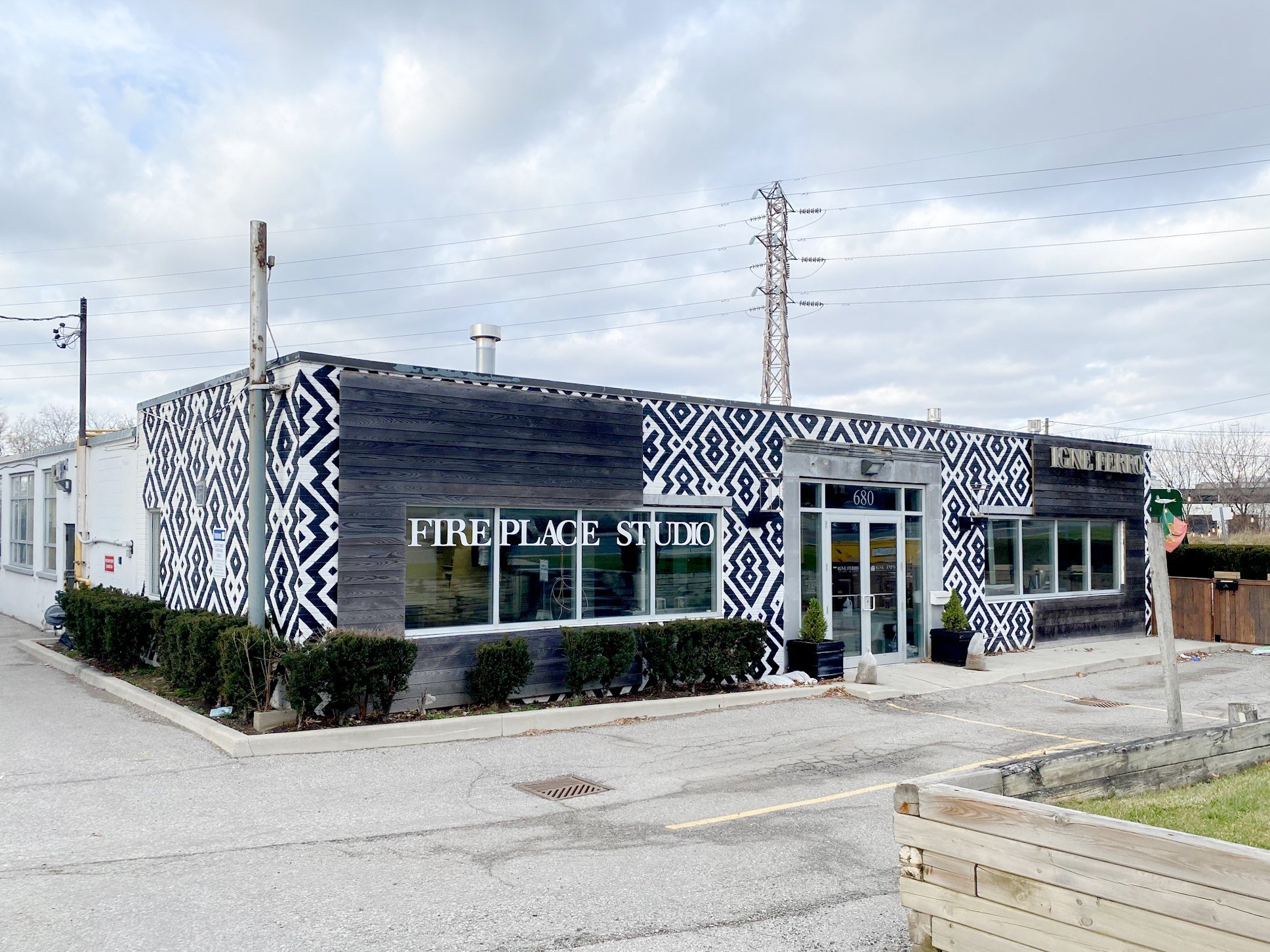 Patterned black-and-white facade of Fireplace Studio