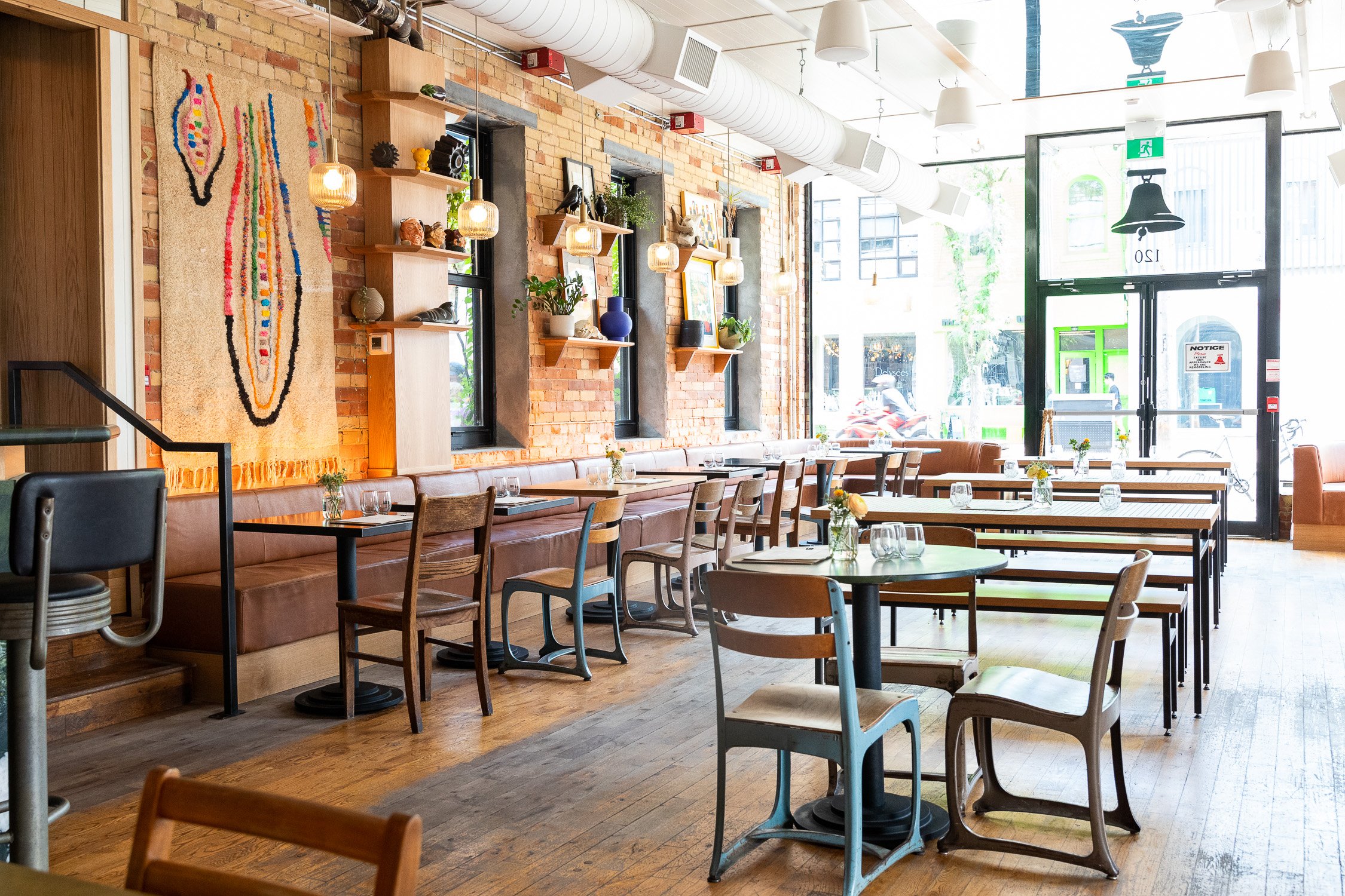 Restaurant with brick wall and wood tables